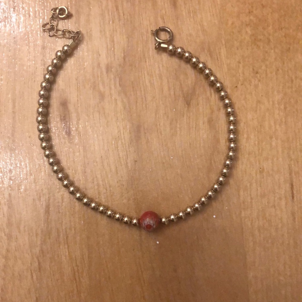 Gold tone gold filled beaded bracelet with red orange bead